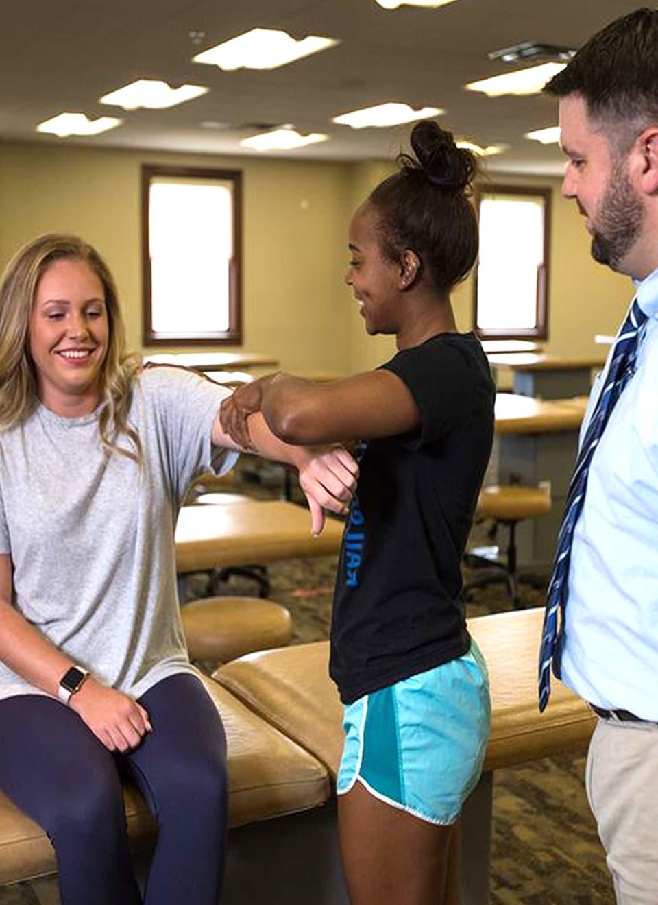 student checking person's arm